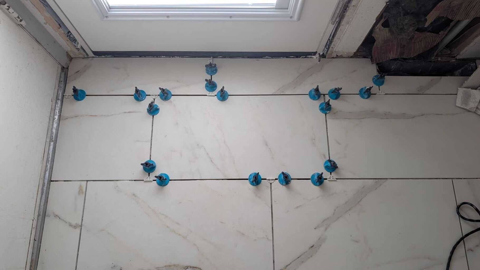 Before grouting, had to replace several tiles that the door installers broke2