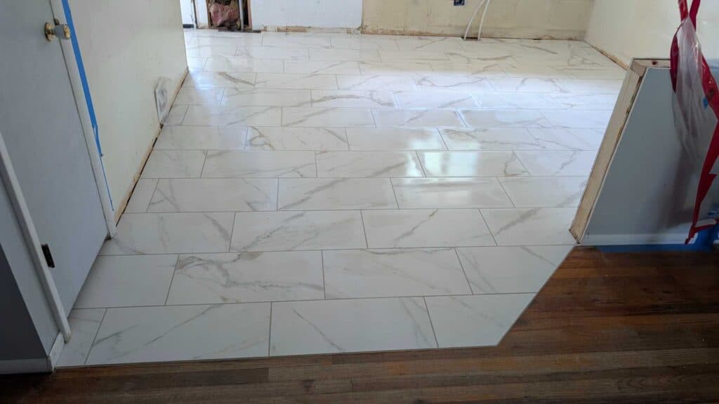 Floor grouted, caulked, and finished