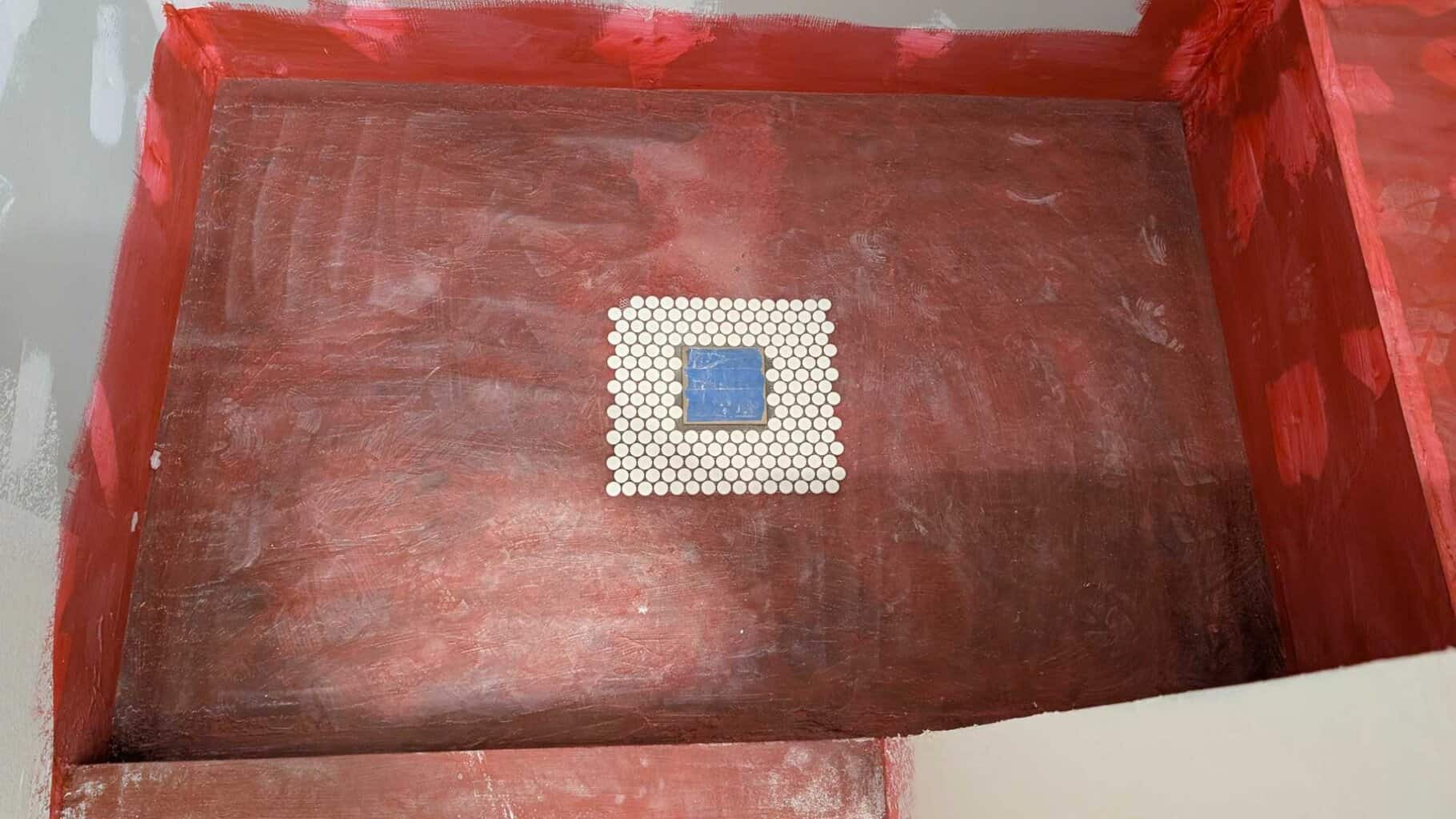 Starting to install pennies on shower floor