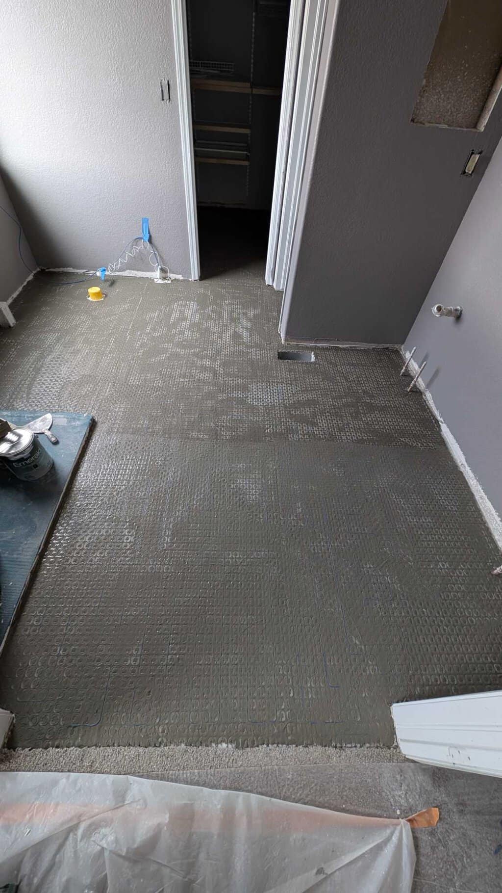 Thinset spread over new warm wire and filling membrane