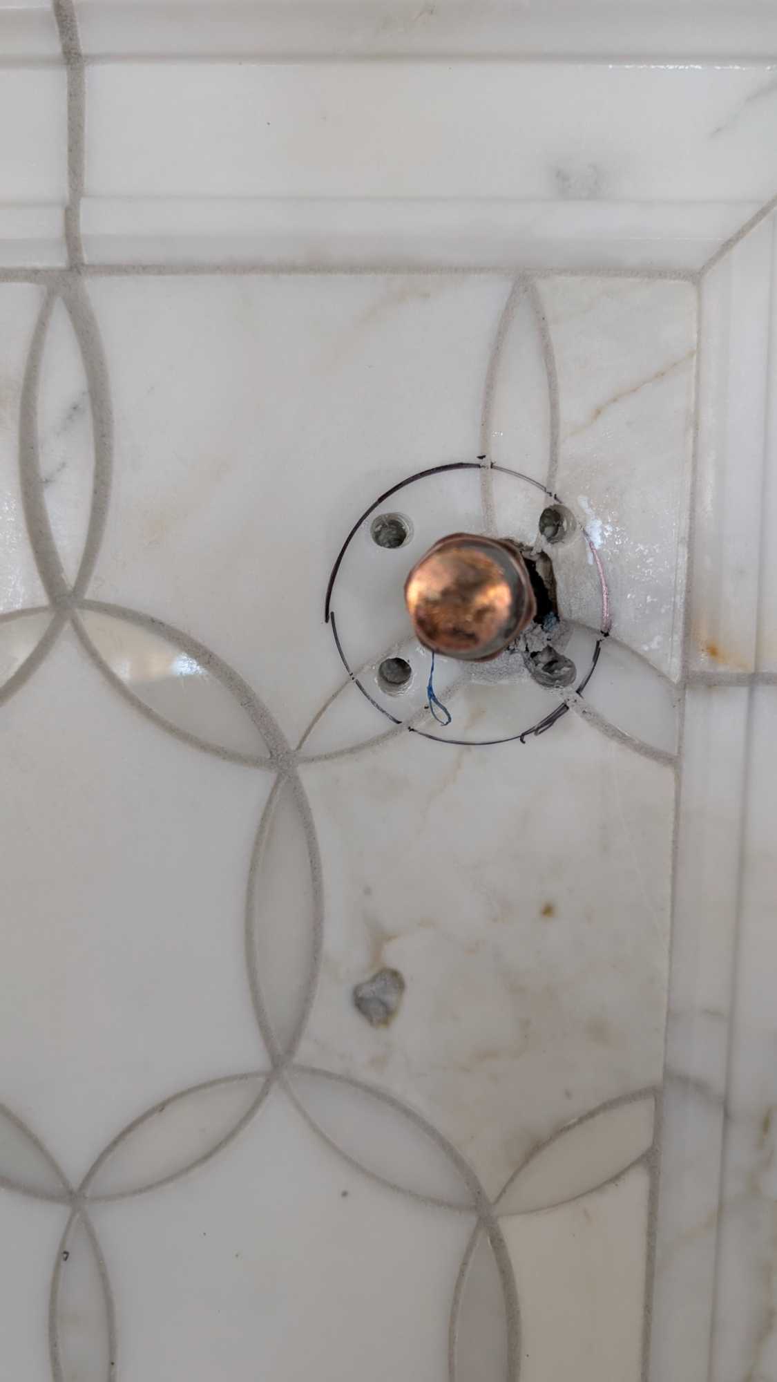 Screw holes drilled for pot filler