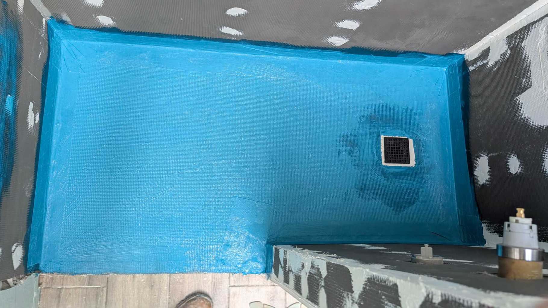 Waterproofed guest shower pan