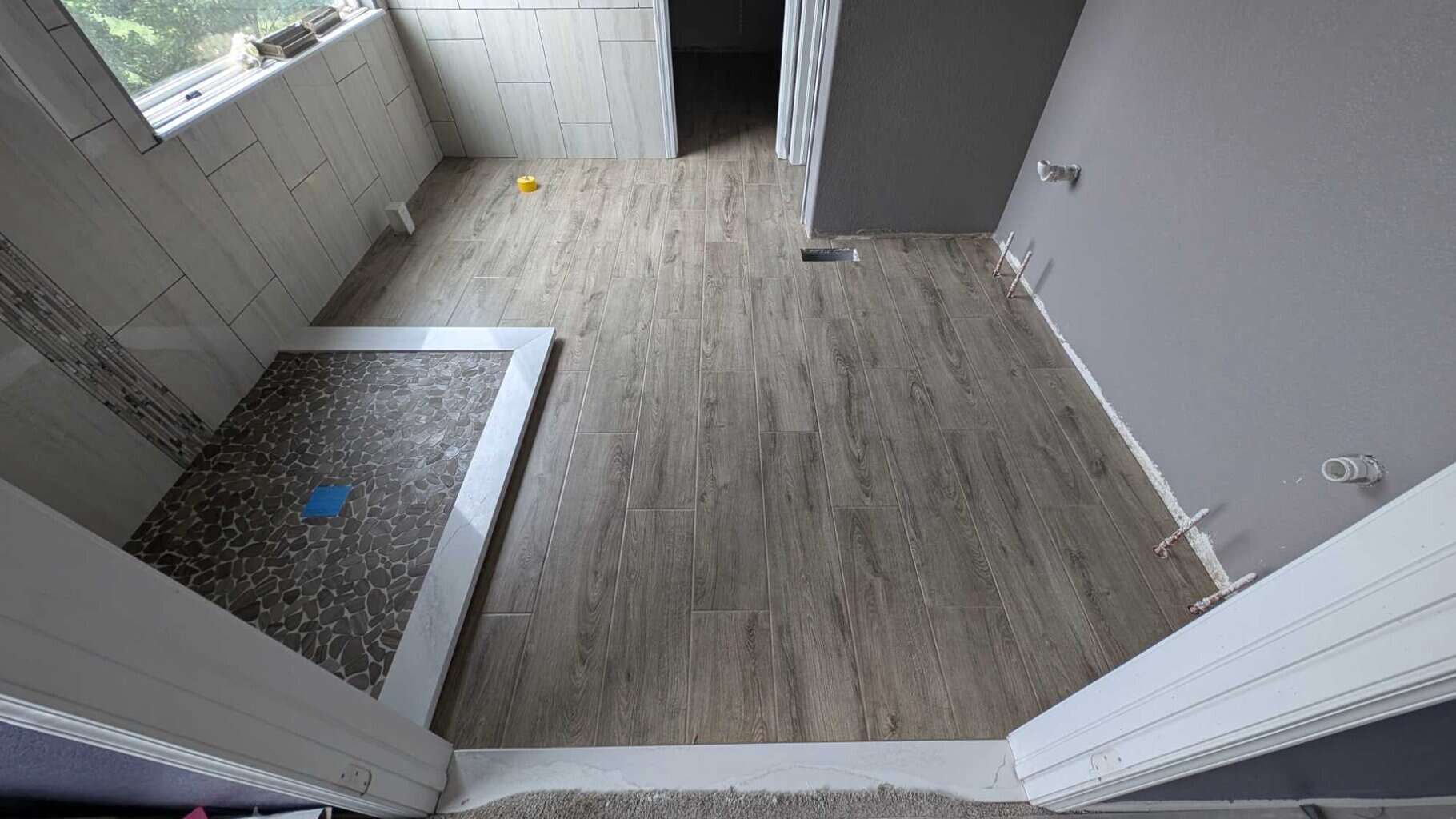 Primary bath and shower floors grouted