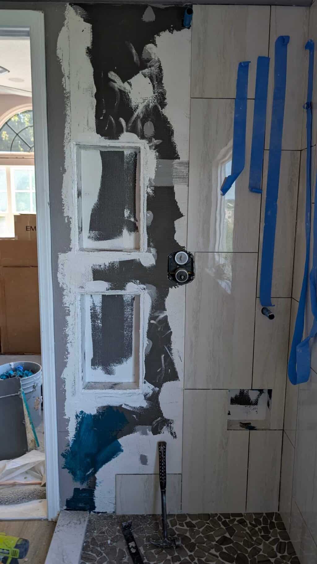Principal shower niches laid out, cut in, and sealed