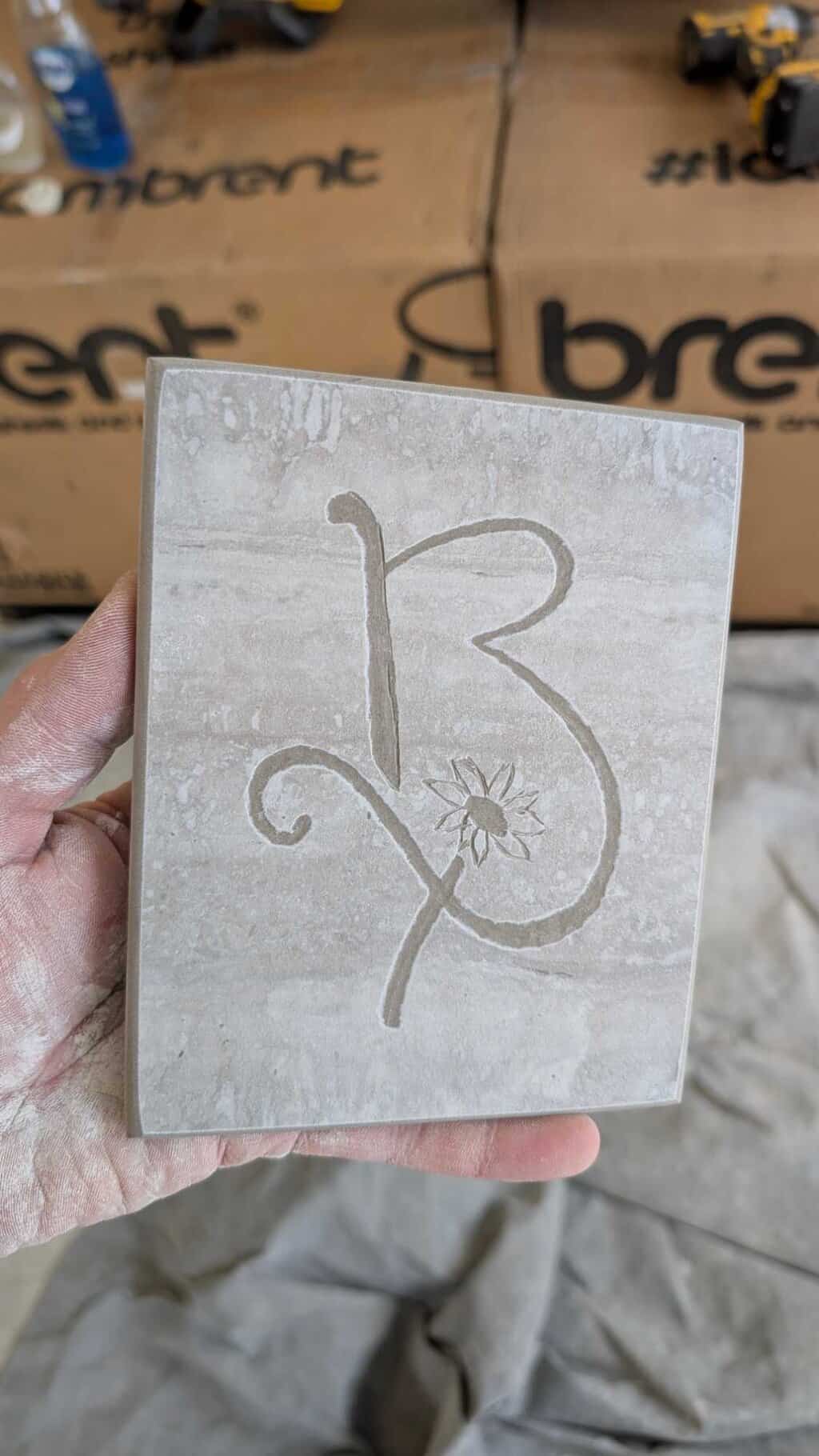 Logo engraved in tile