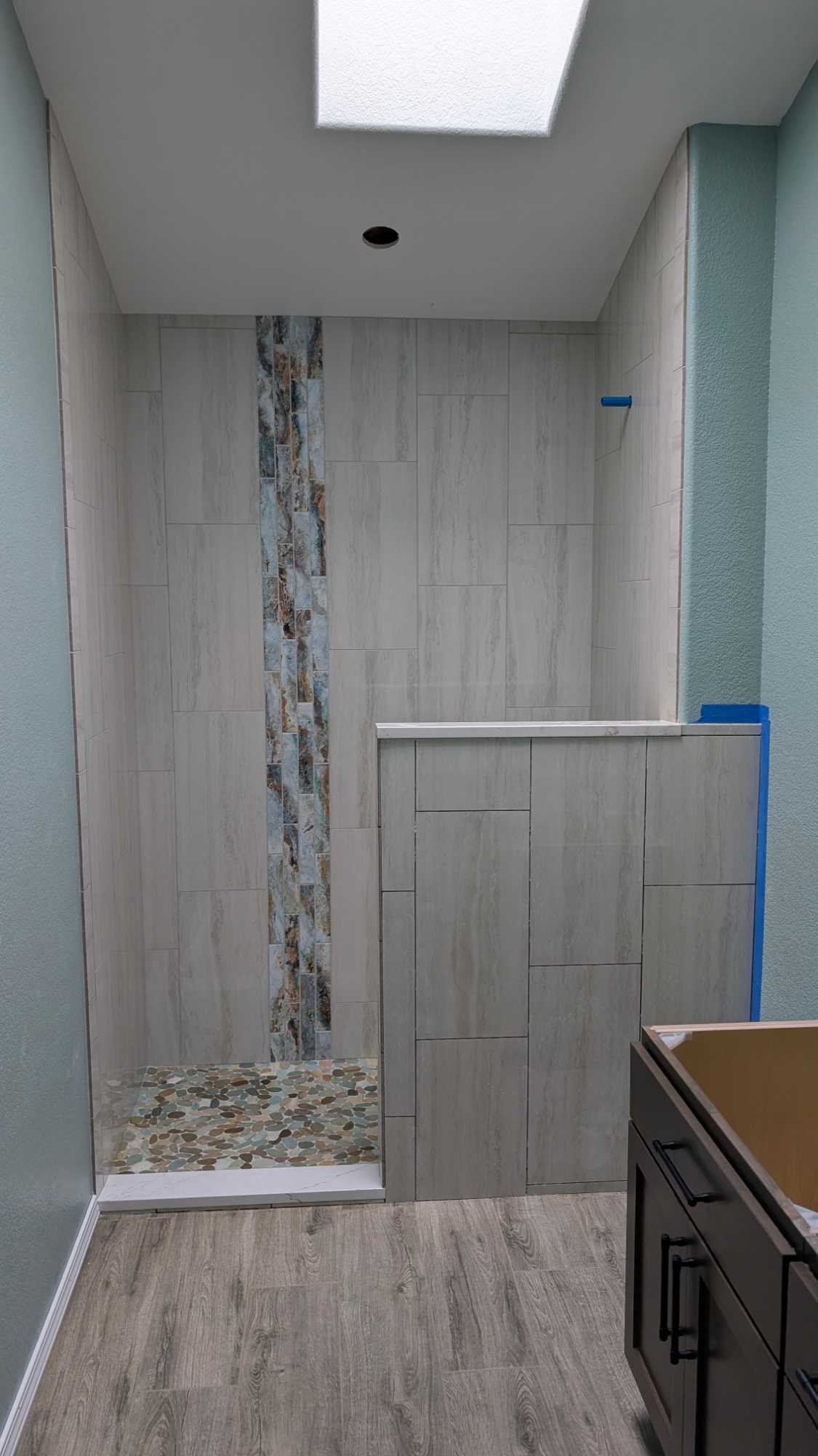 Hall shower almost completely grouted