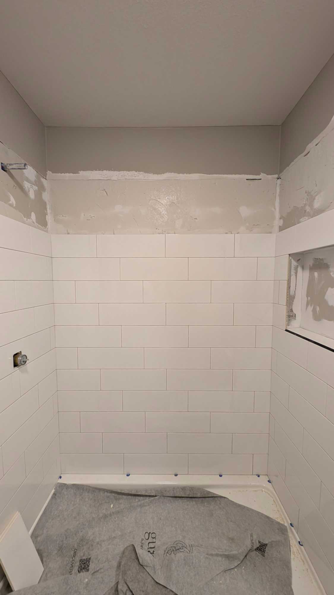 Part of basement shower tiled