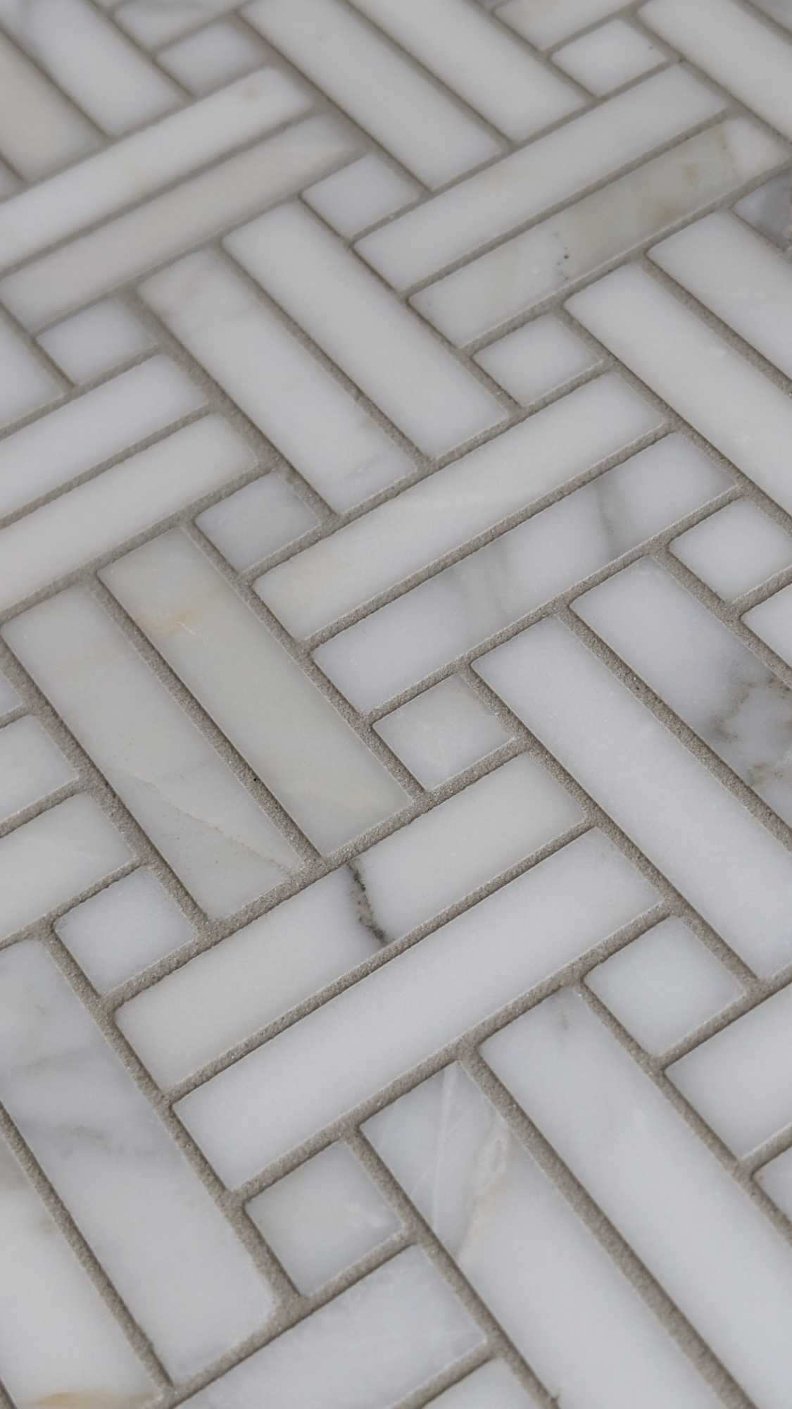 Closeup of basketweave tile for family room fireplace
