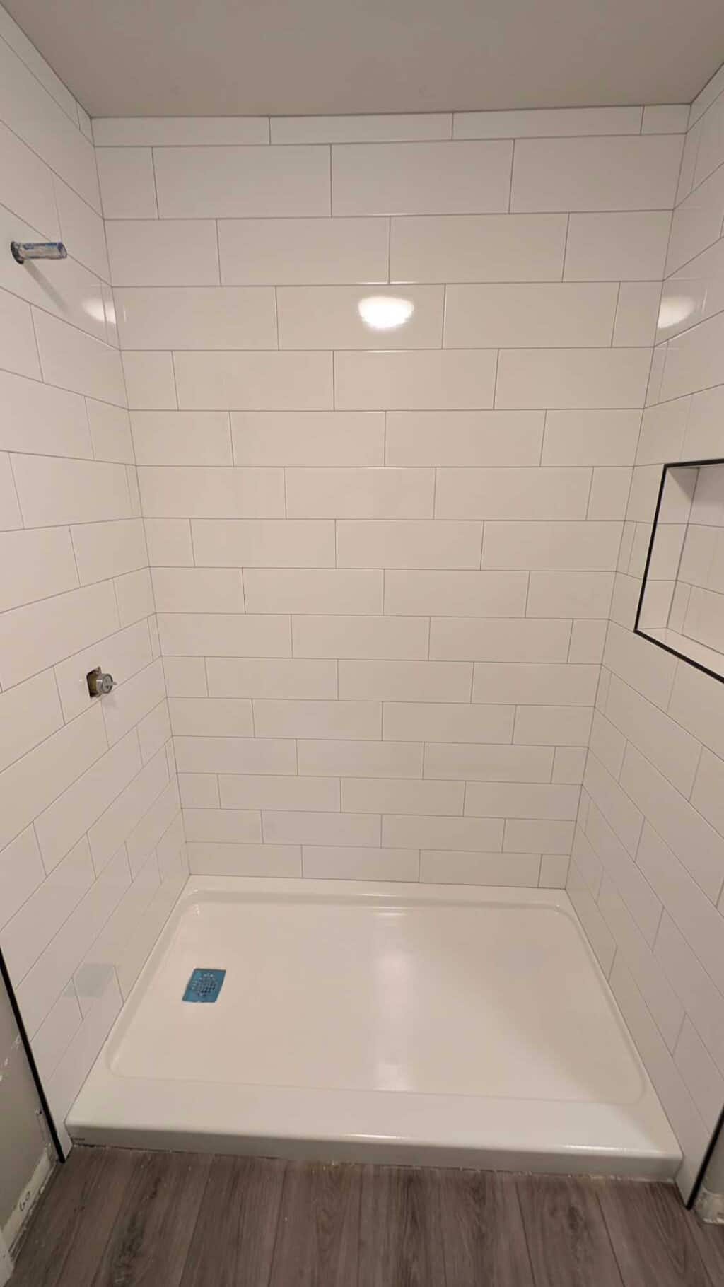 Basement shower grouted and finished