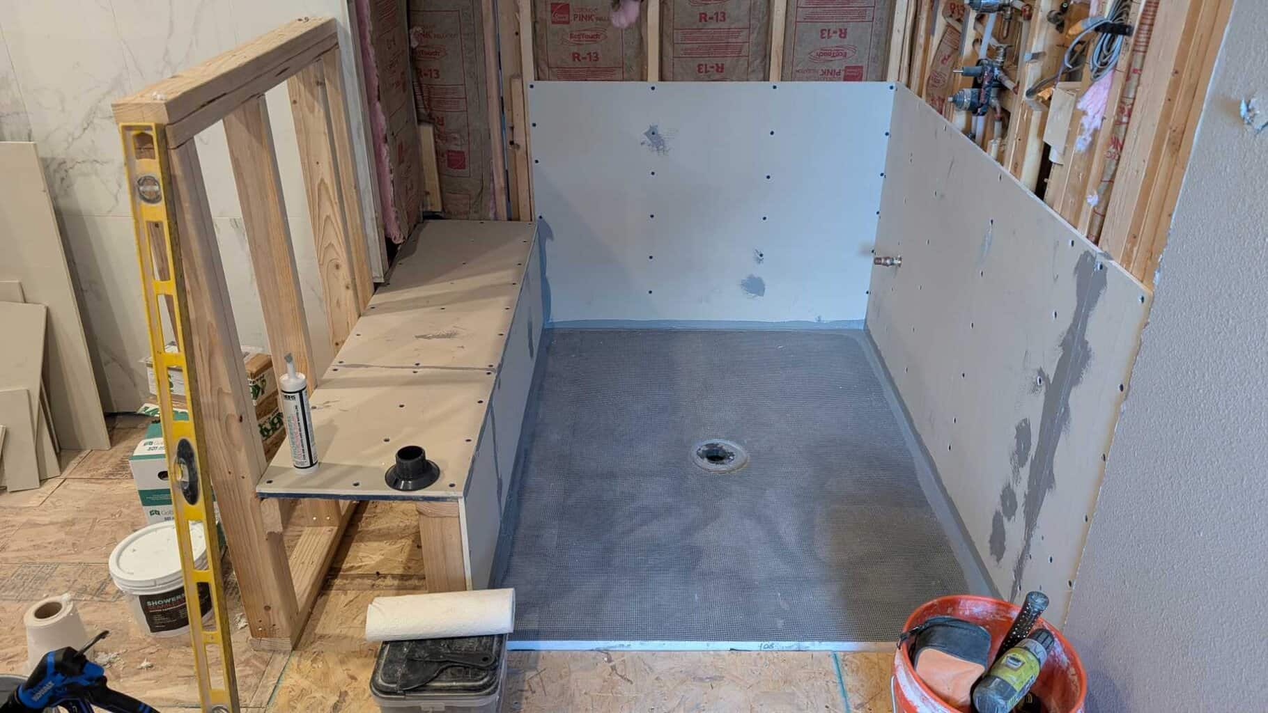Shower pan installed and ceiling and some walls underlaid2