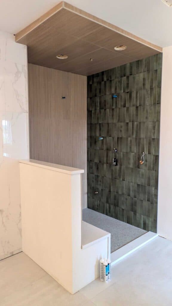 Primary bathroom shower is grouted and finished2