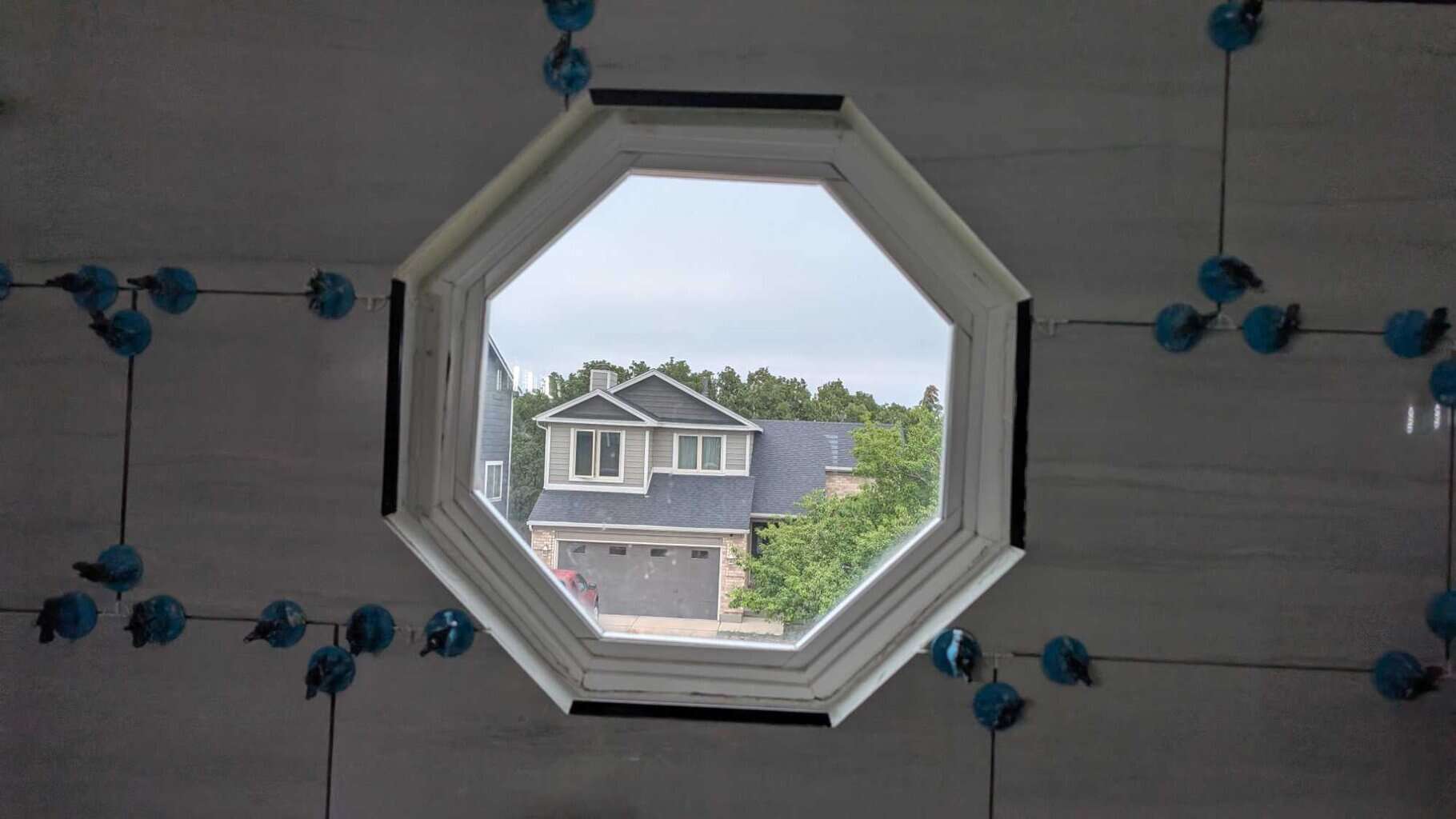 VERY tricky Schluter cuts around this octagonal window