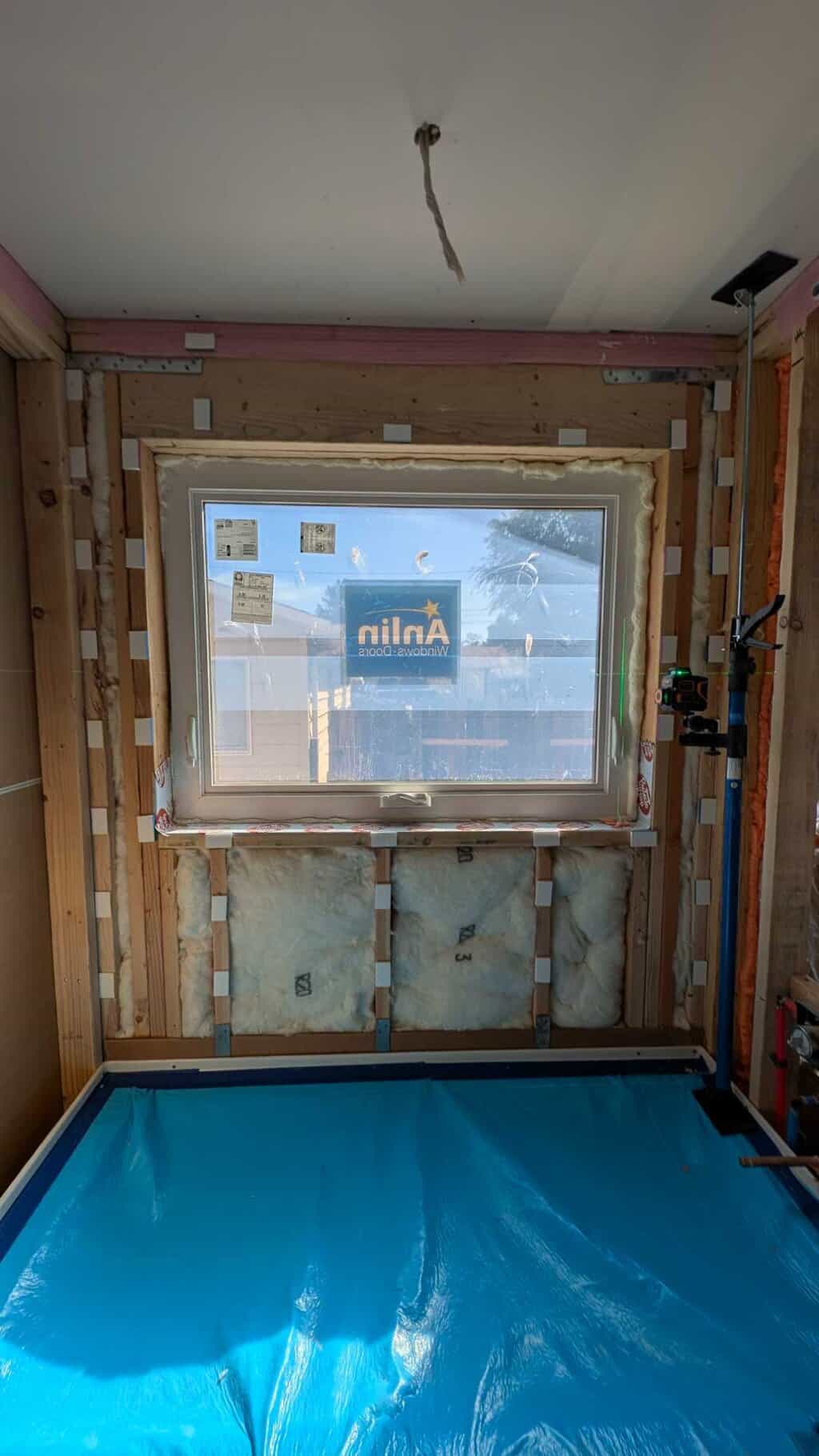 Using foam shims to furr the wall flat