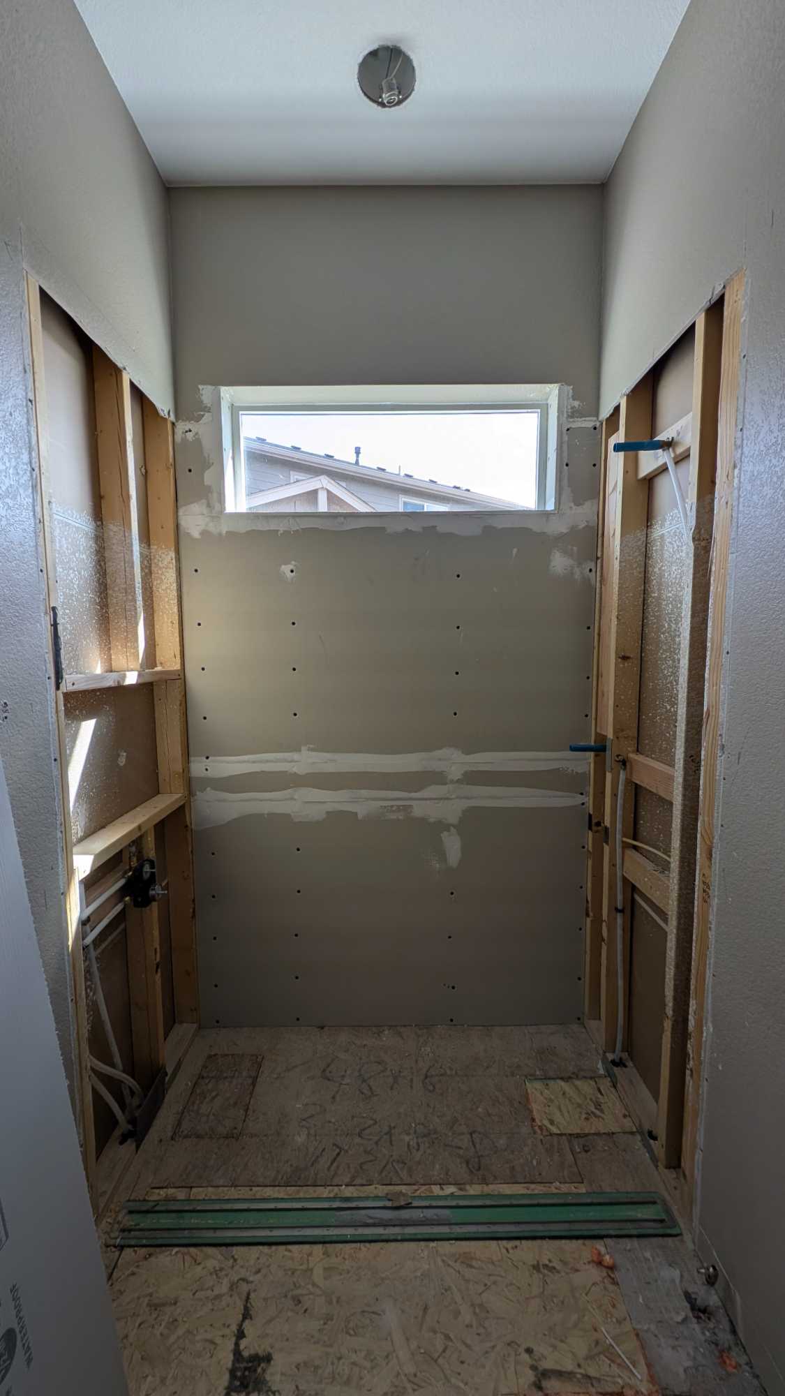 Hall bath shower partly underlaid