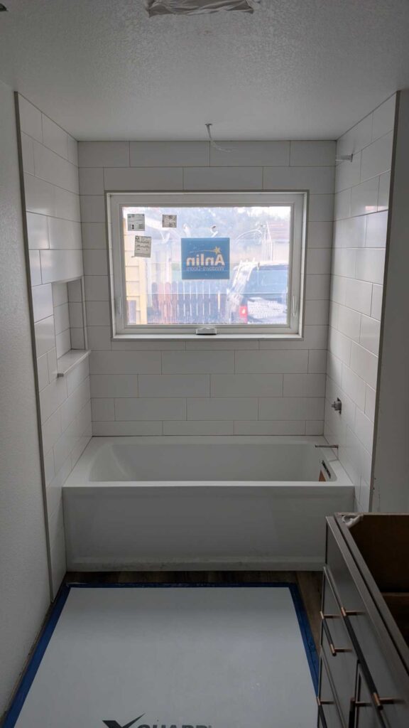 Primary tub surround grouted and finished