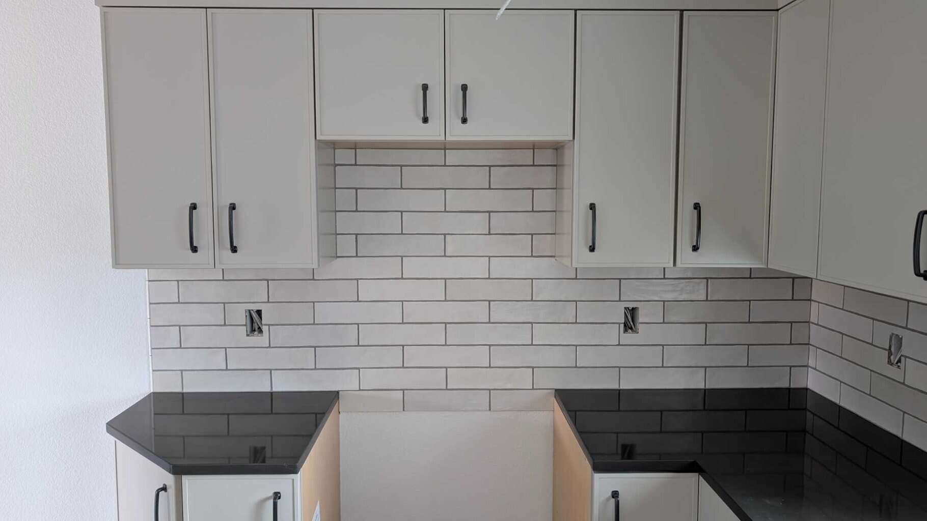 Backsplash grouted, caulked, and finished3