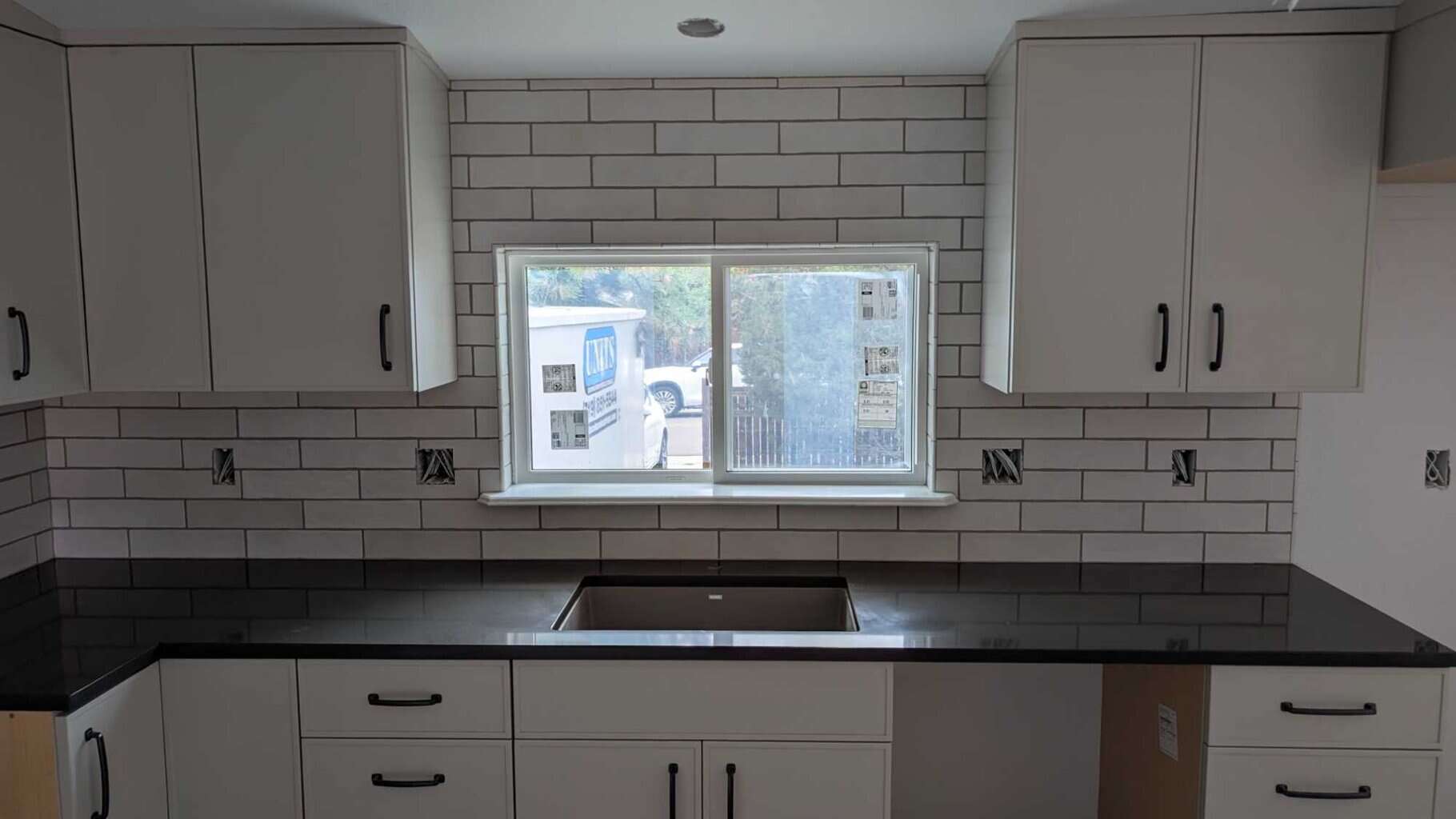 Backsplash grouted, caulked, and finished4