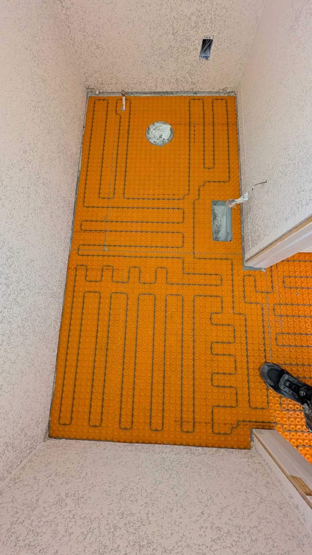 Warm wire installed in primary bath floor