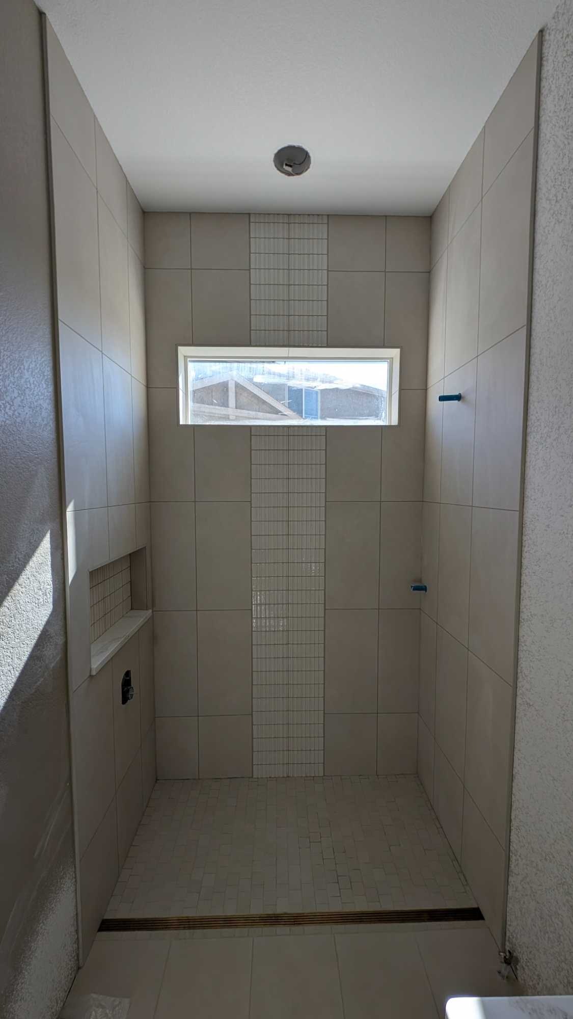 Hall bath shower grouted and finished