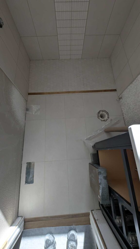 Hall bath shower and floor grouted and finished