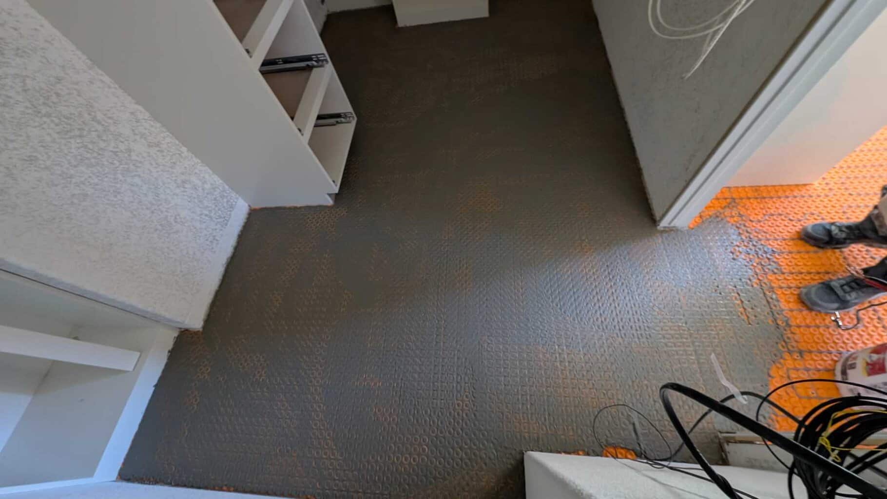 Thinset floated over closet warm wire