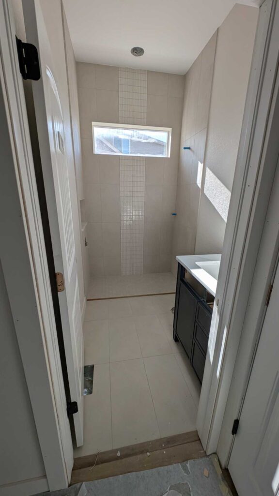 Hall bath floor and shower completely finished