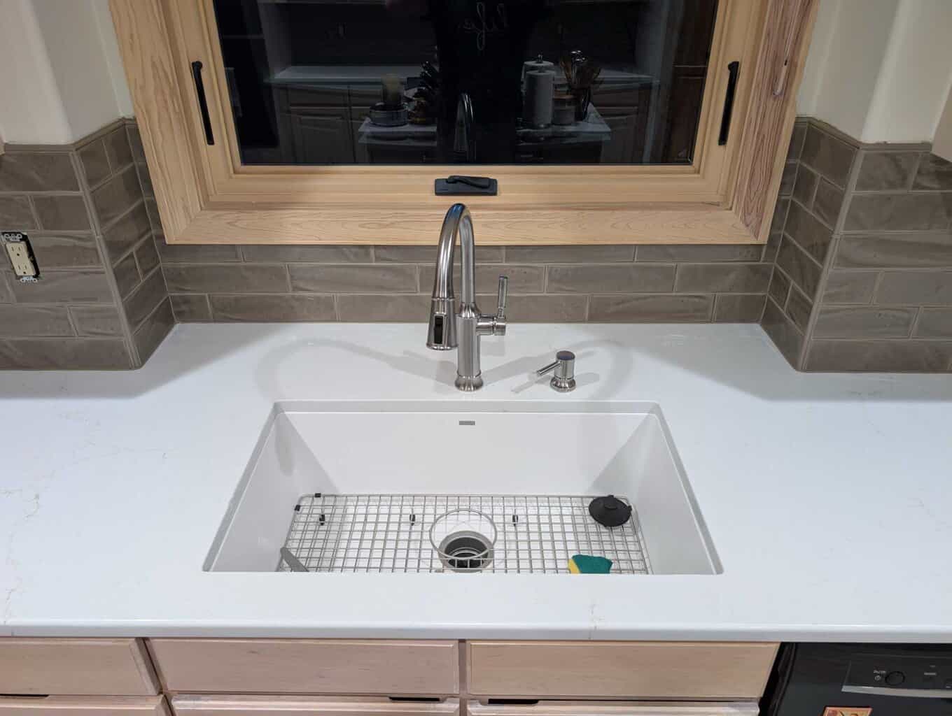 Backsplash grouted, caulked, and finished