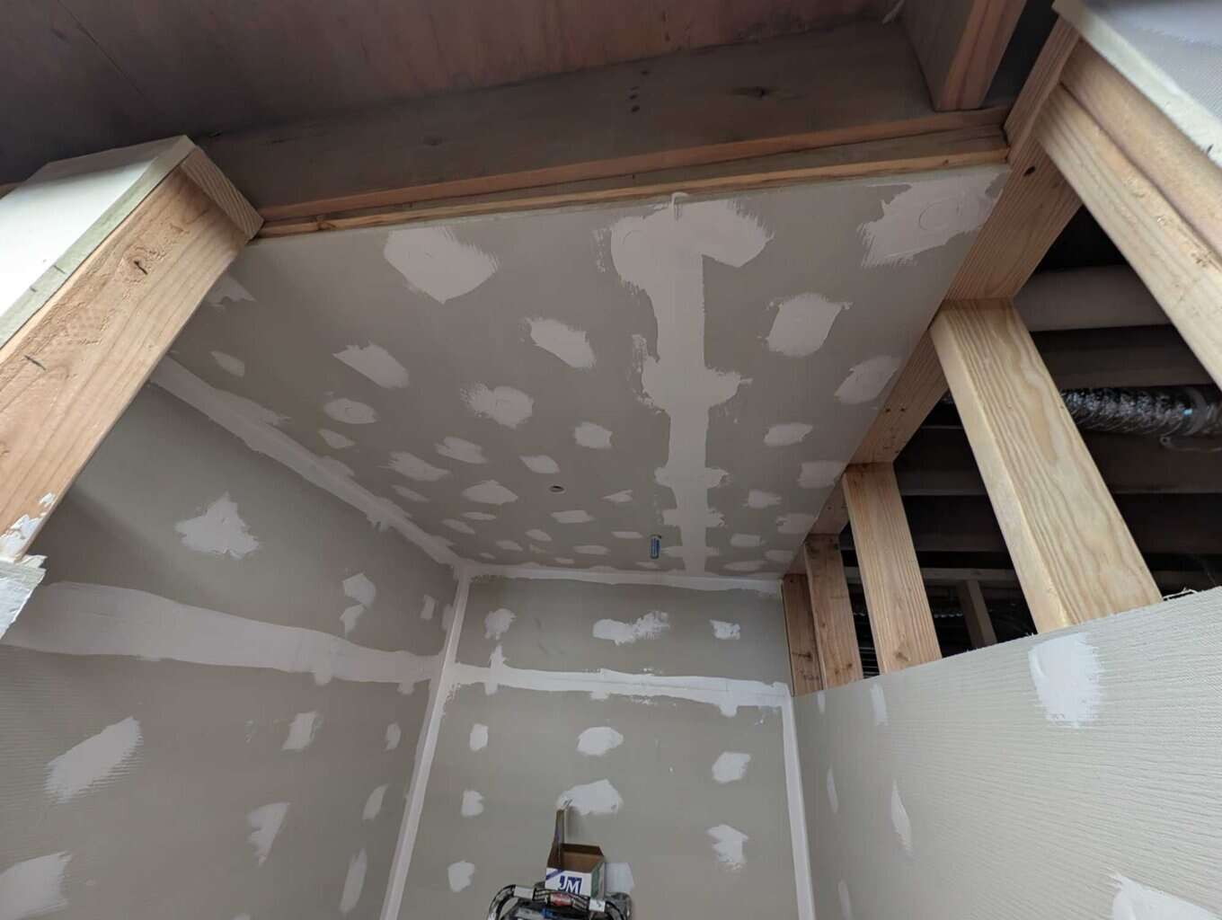 Goboard installed on ceiling and walls that don't touch the header