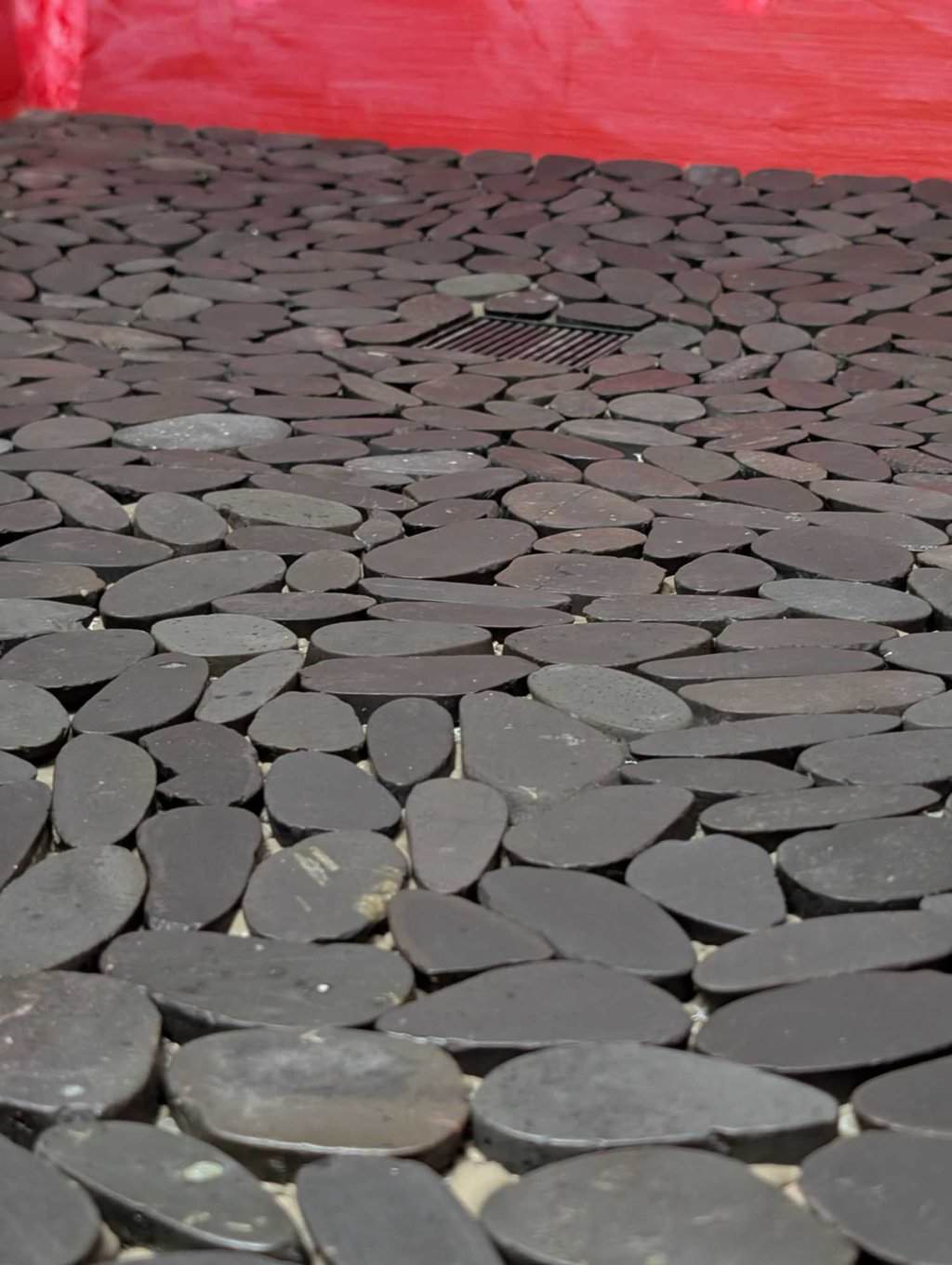 Primary shower pebbles closeup