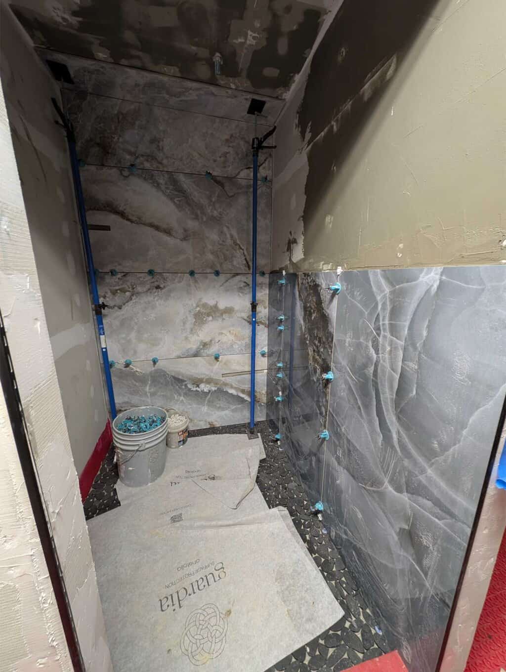 Getting a start tiling this primary shower