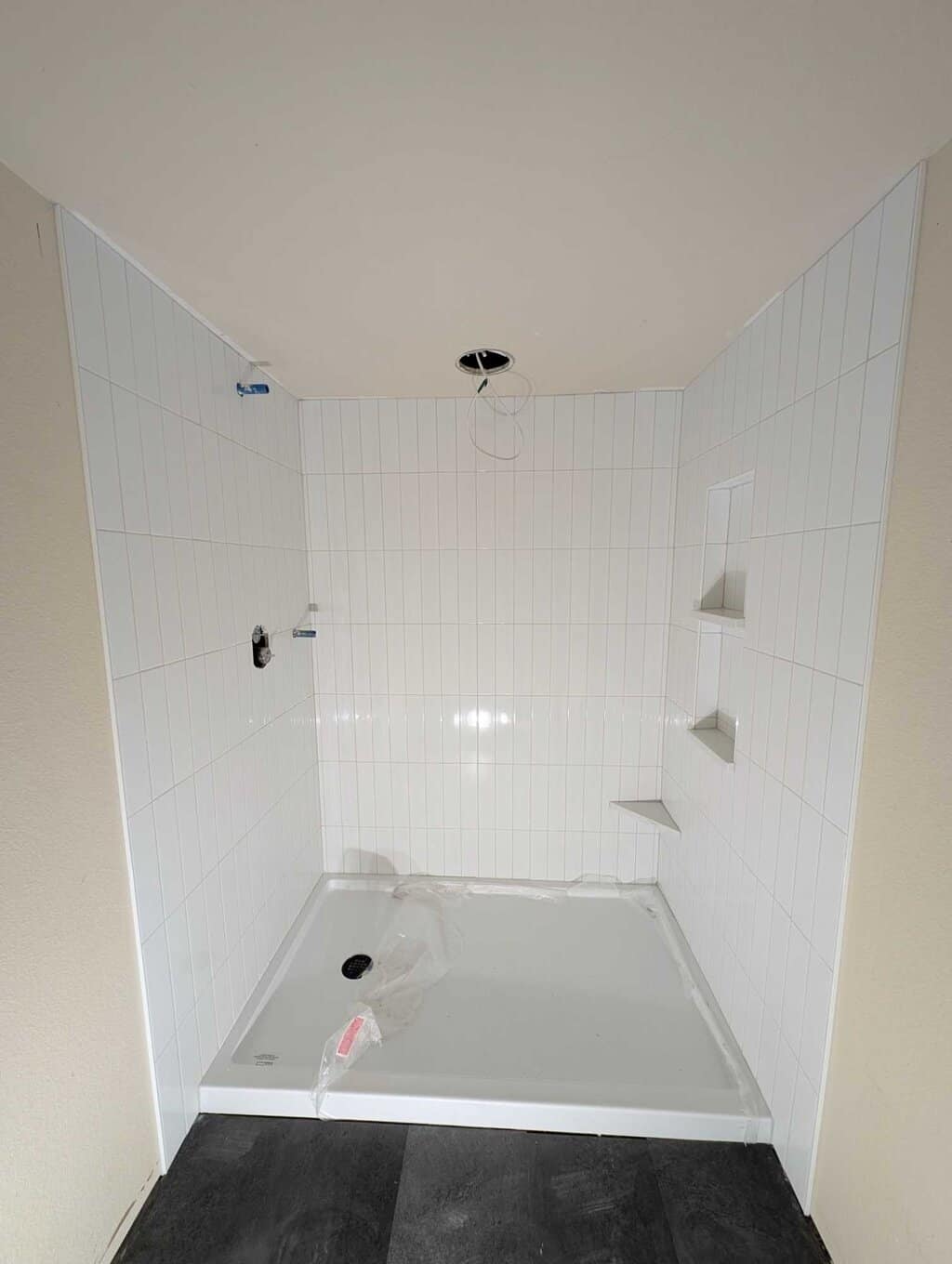 Basement shower surround grouted and finished