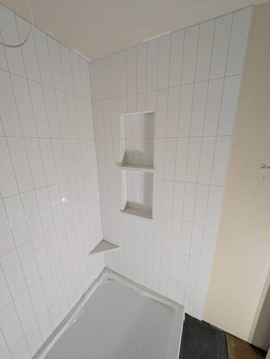 Basement shower surround grouted and finished