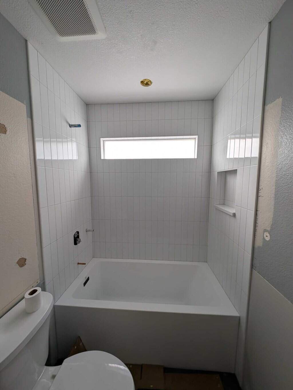 Tub surround grouted and finished