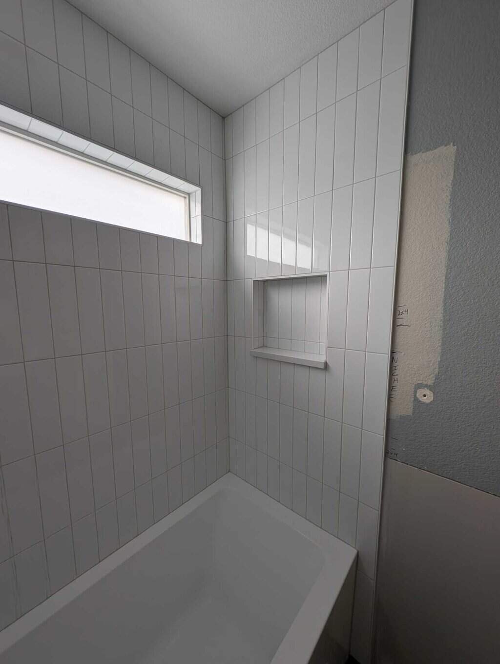 Tub surround grouted and finished