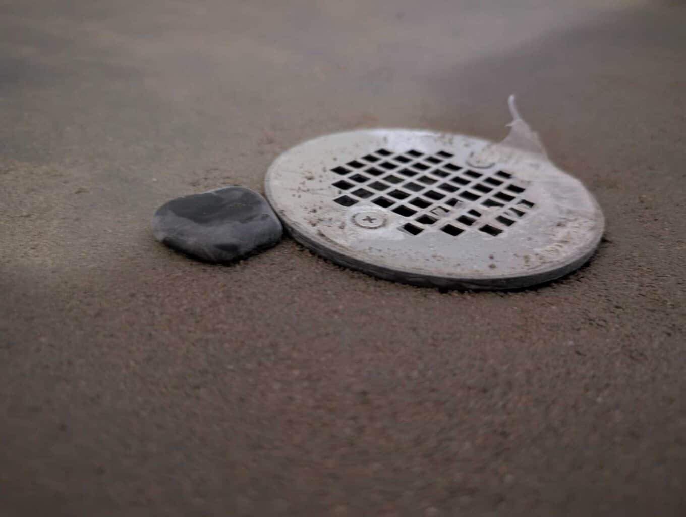 Drain installed to floor pebble height