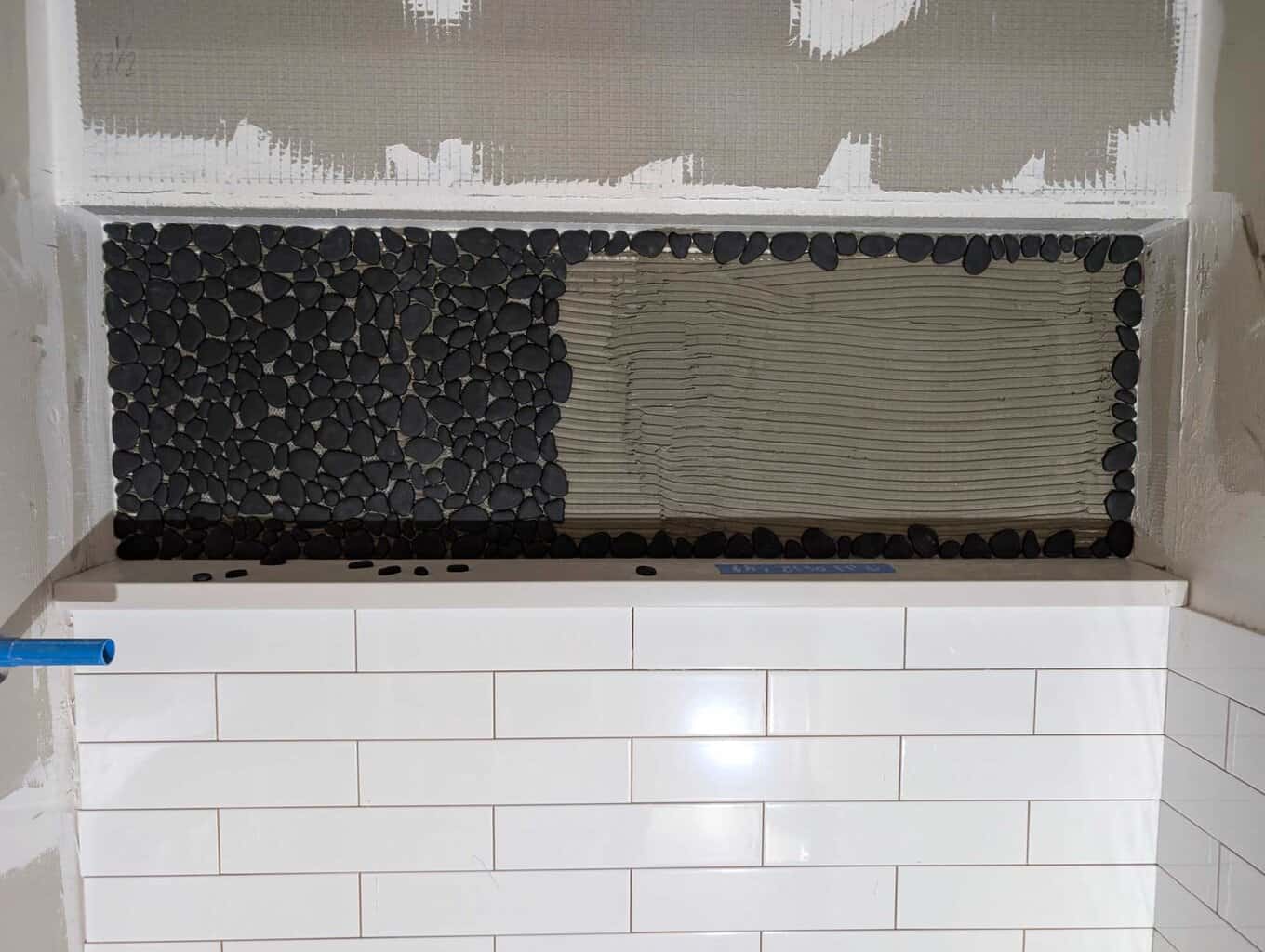 Installing pebbles in niche