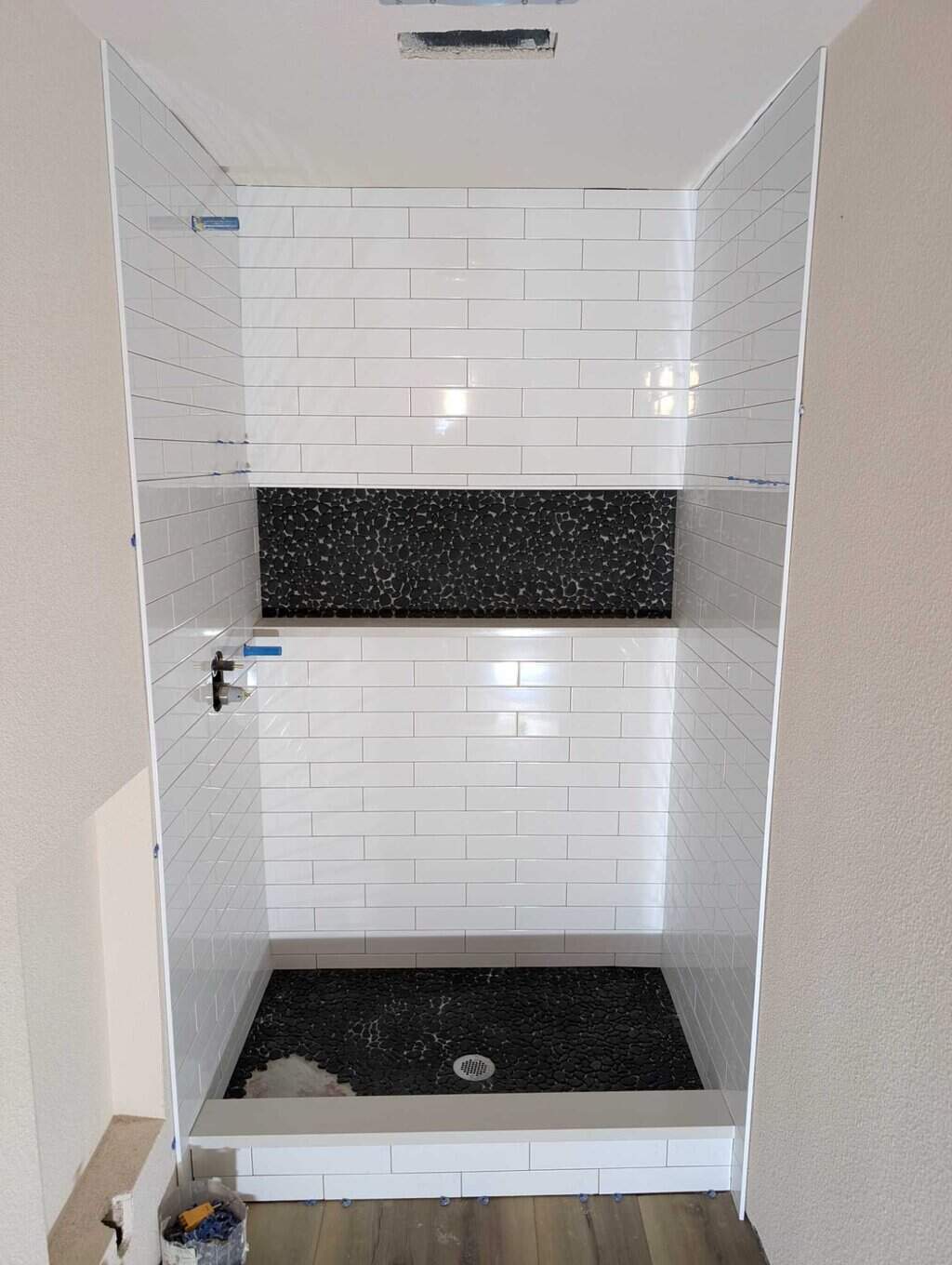 Shower fully set except for missing pebbles
