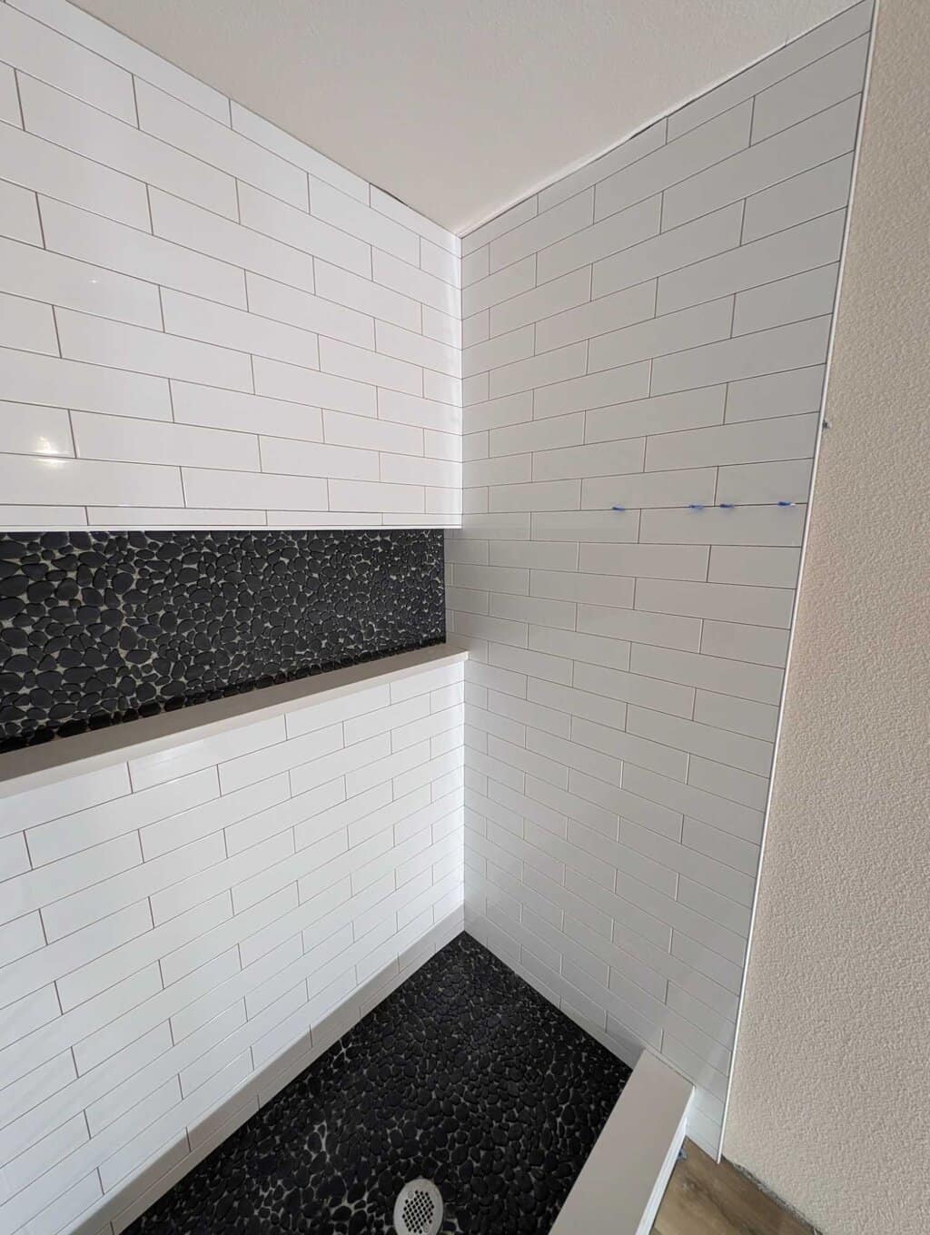 Shower fully set except for missing pebbles