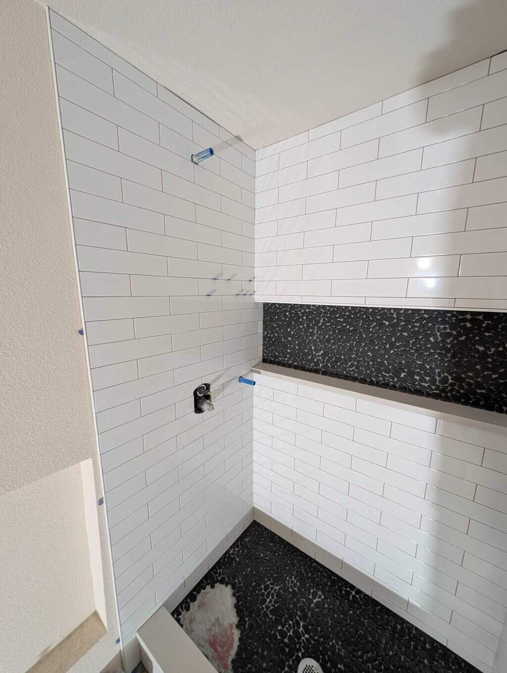 Shower fully set except for missing pebbles