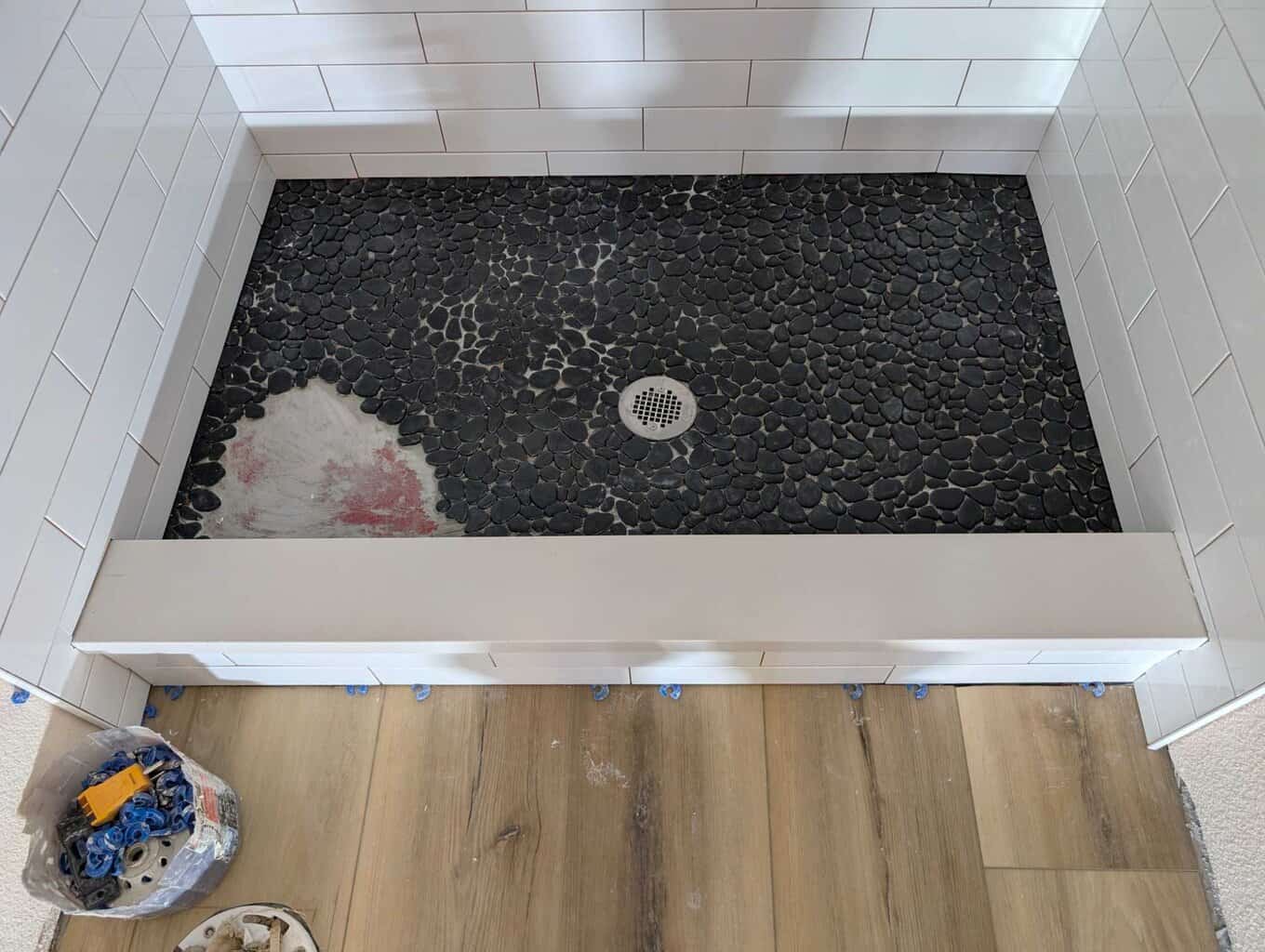 Shower fully set except for missing pebbles