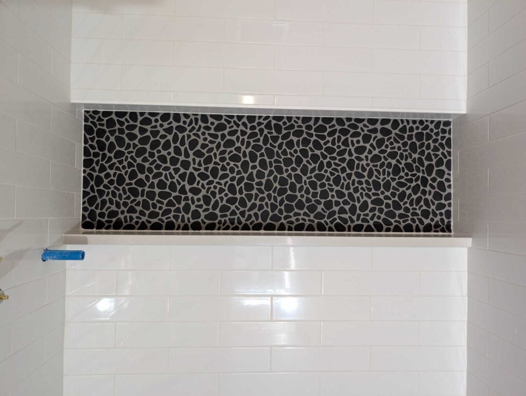 Niche grouted and caulked