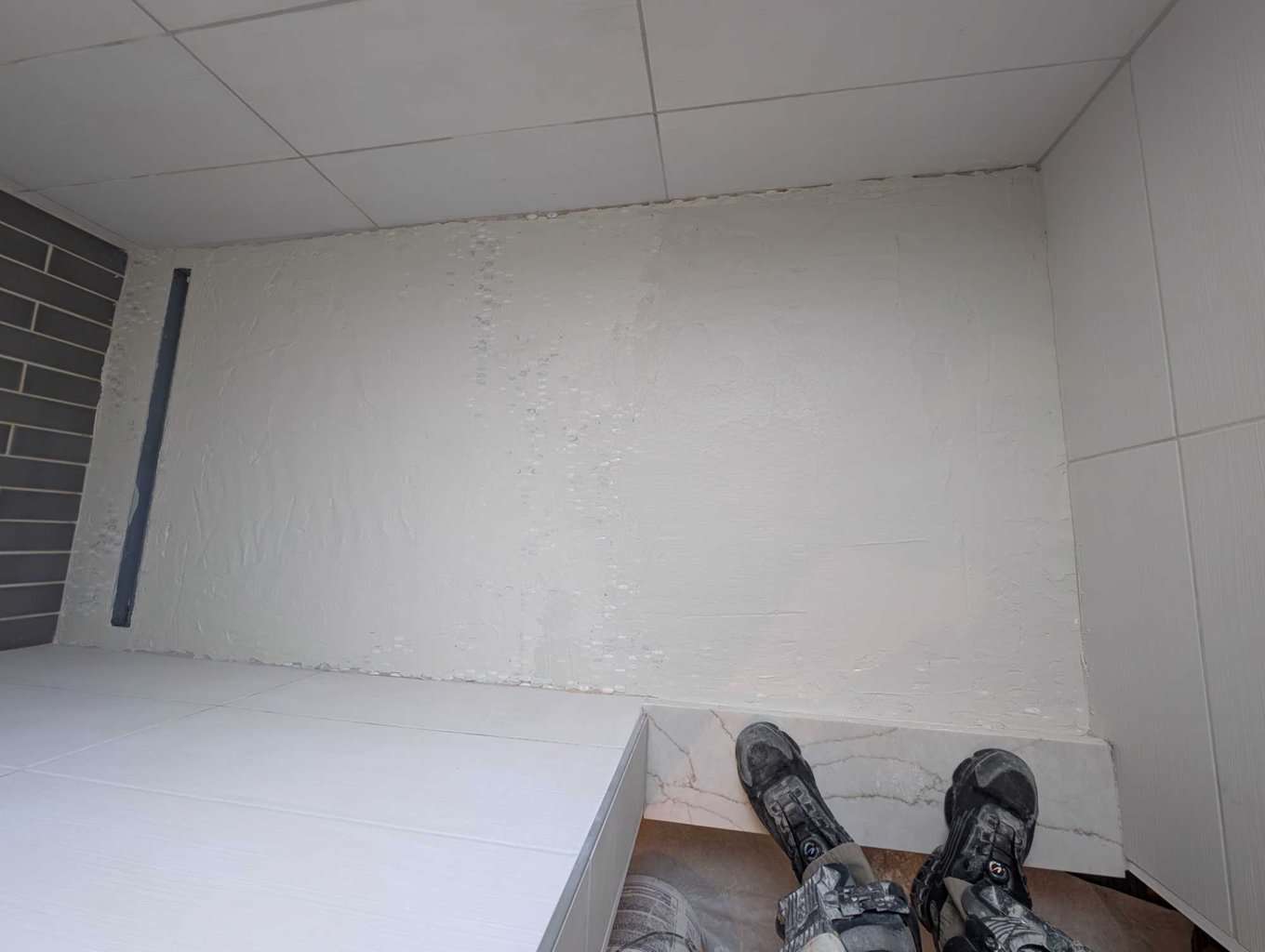 Shower floor primed and floated with thinset