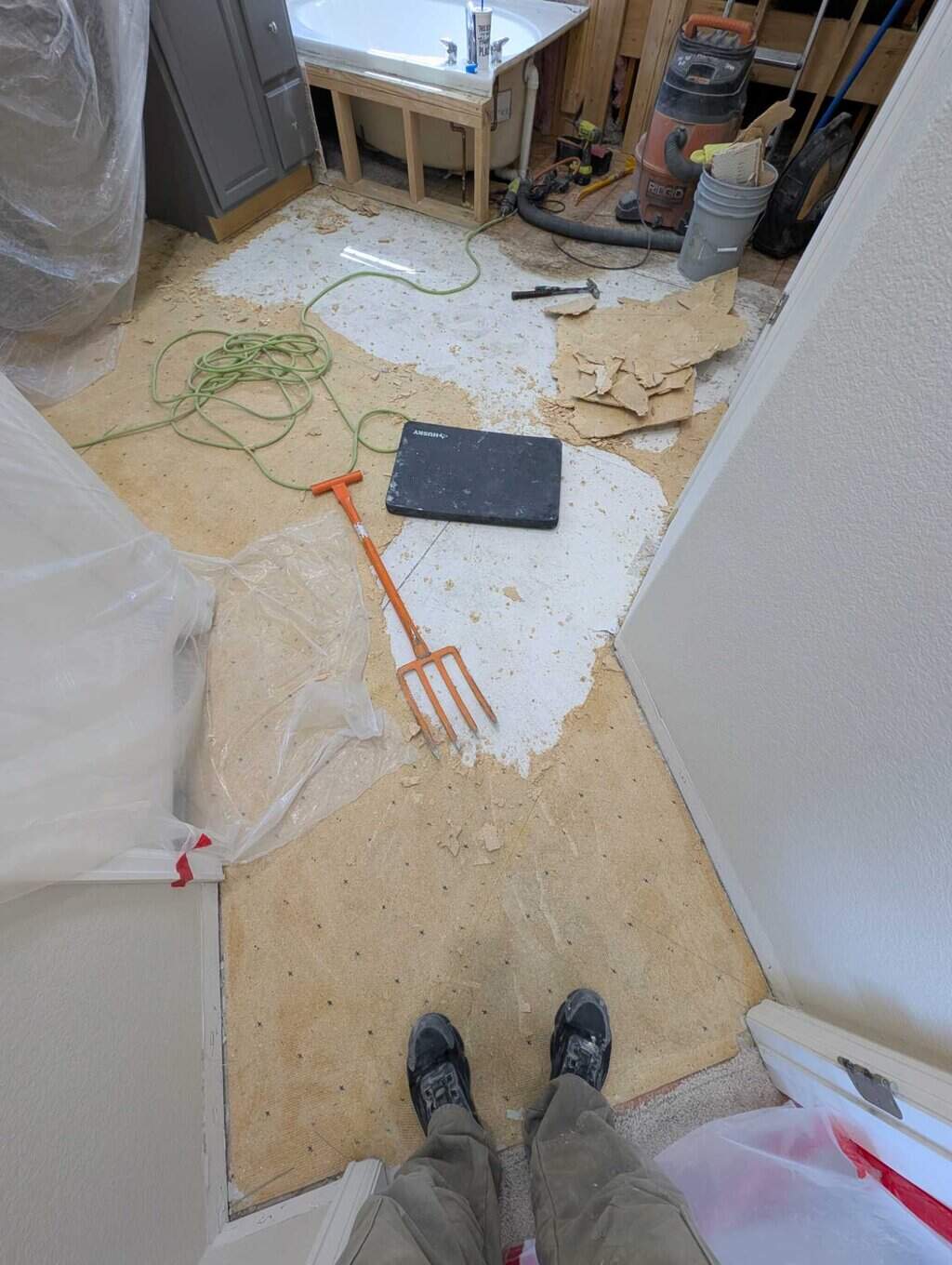 Slowly removing chipboard underlayment