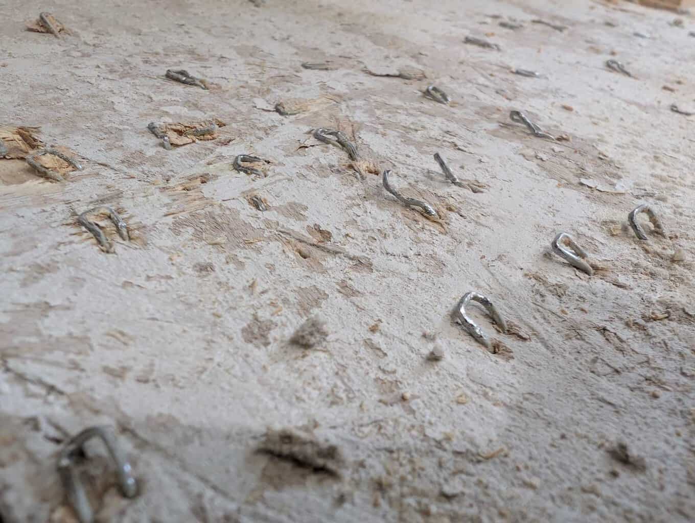 Bending over all of the vinyl underlayment screws