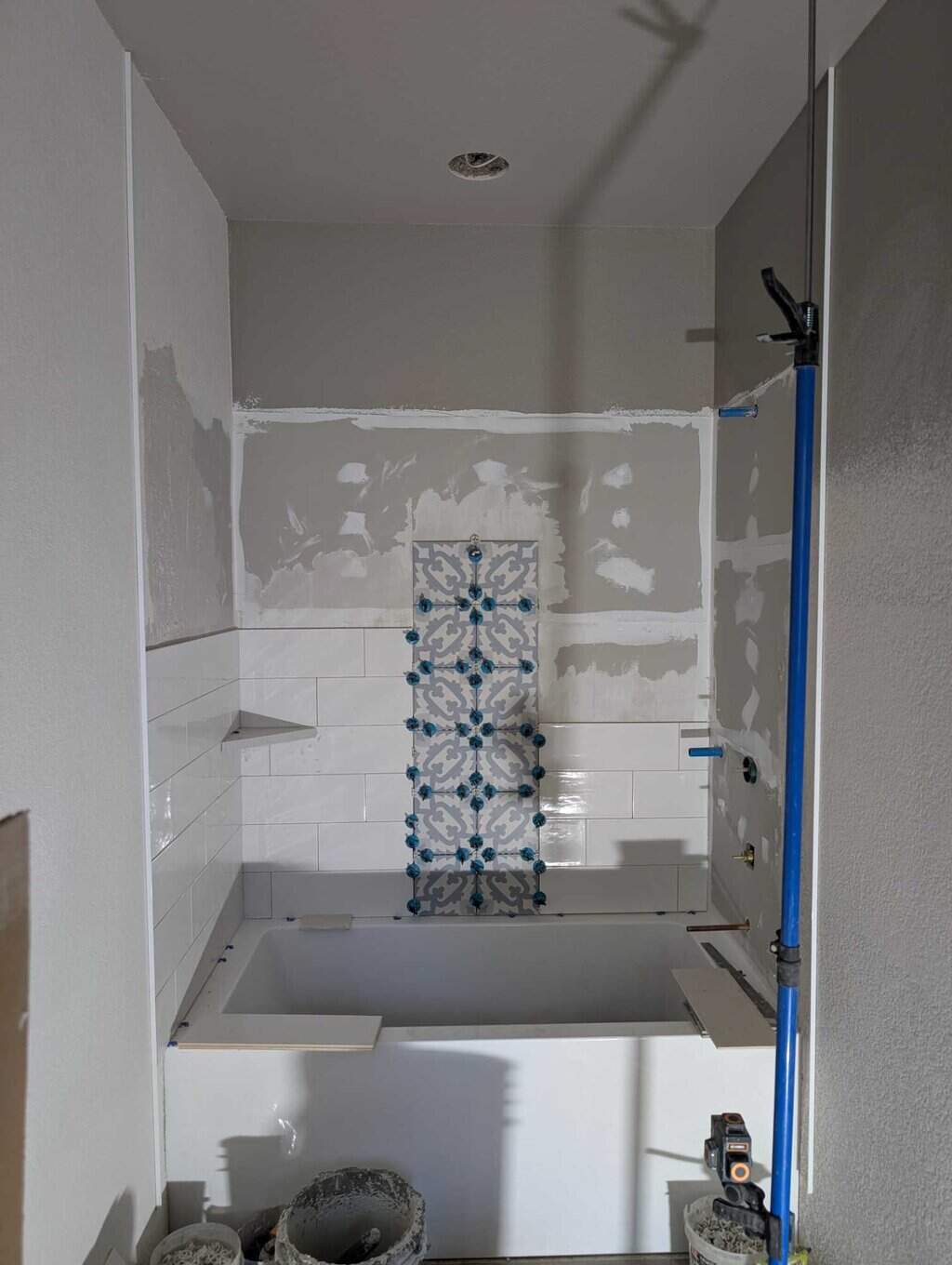 Tub surround partly set