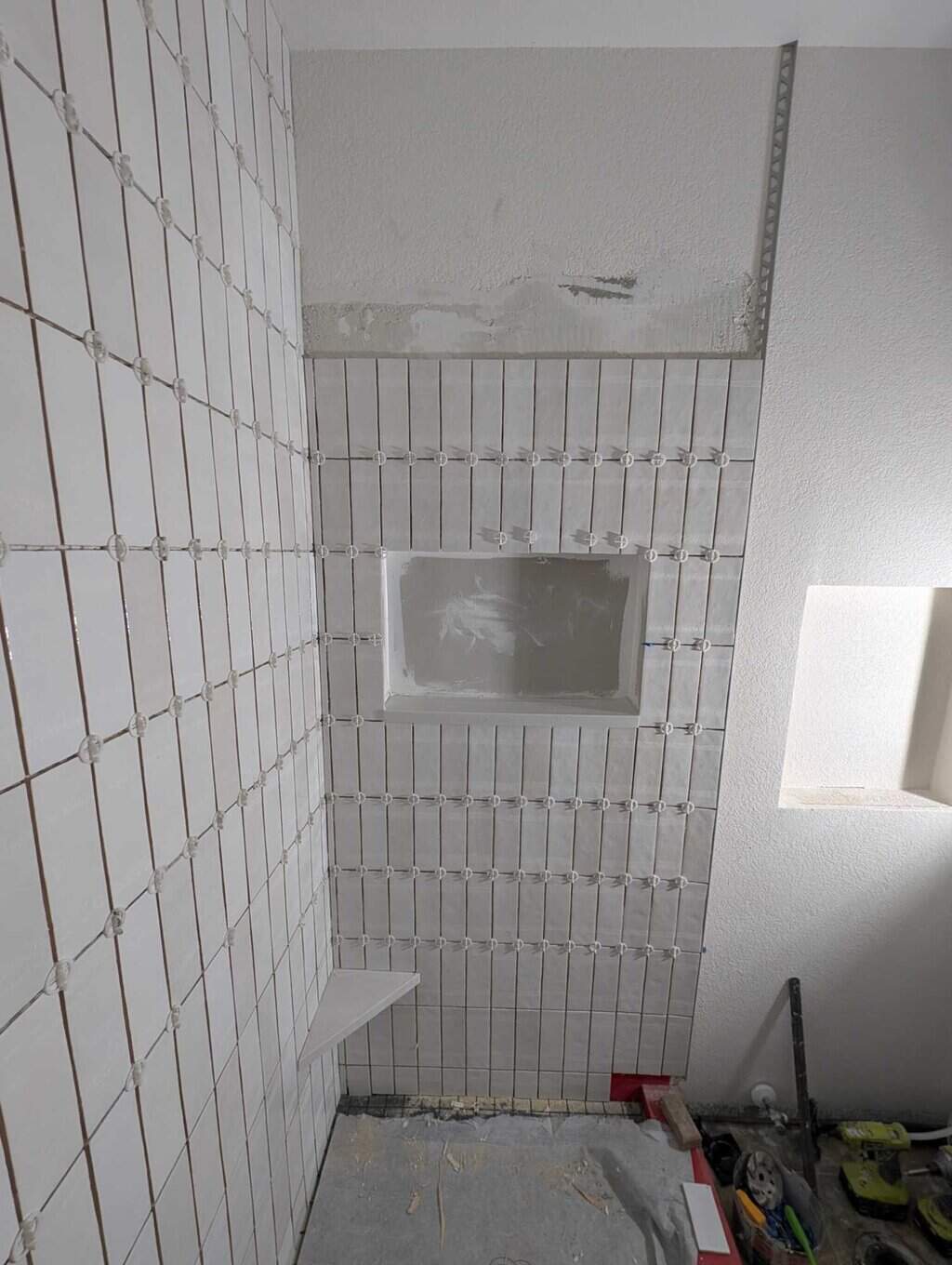 Niche sill installed and tile around