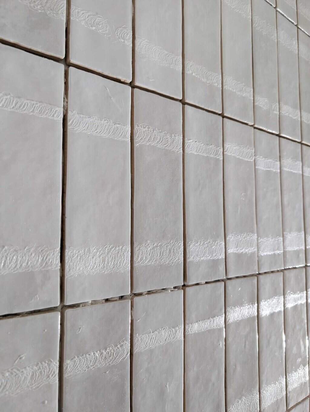 Glue residue to remove on every tile