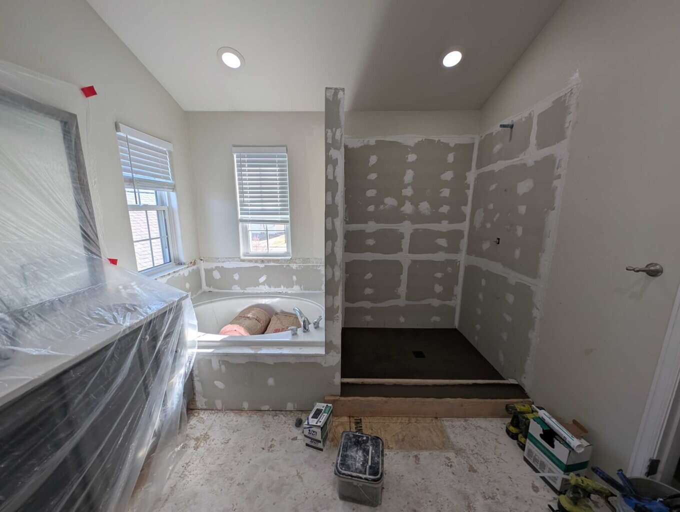 Finished shower pan and wall underlayment/sealant