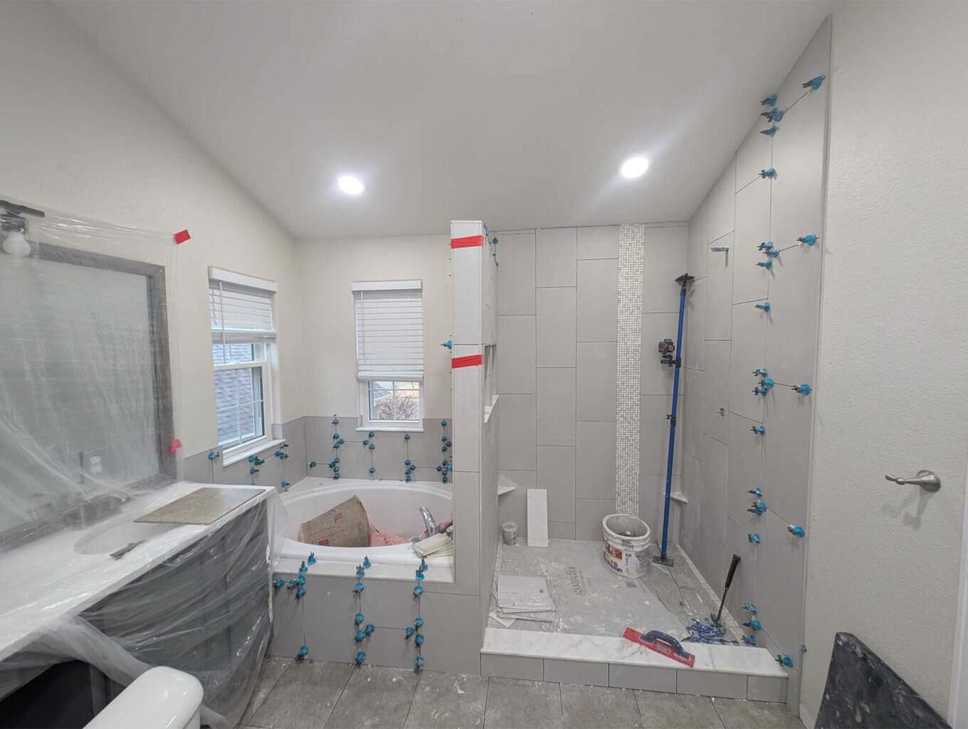 Primary bath floor, shower, and tub fully set