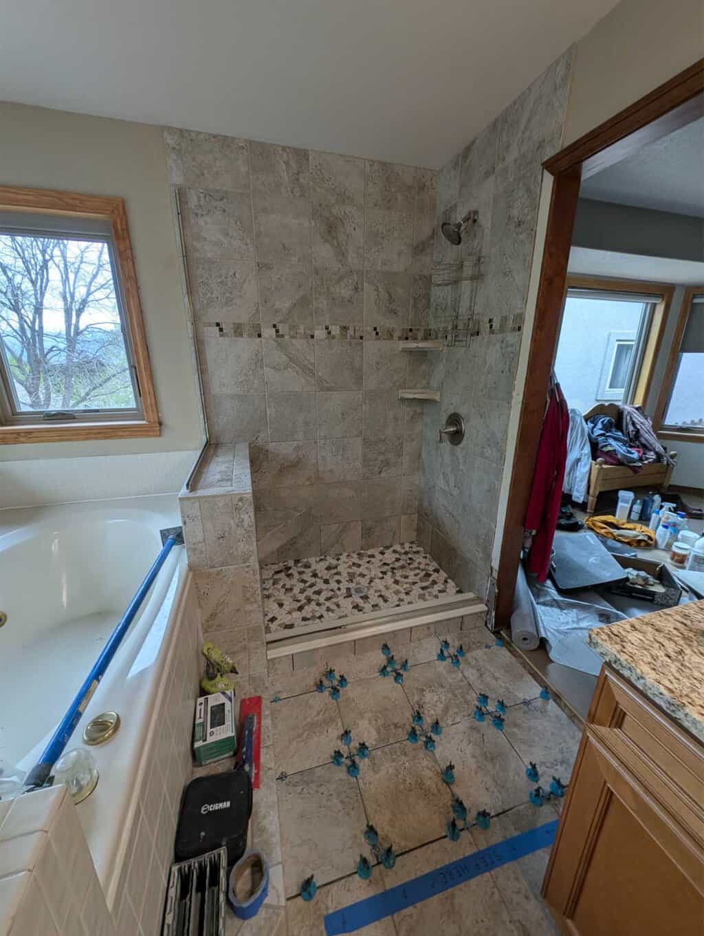 Primary bath tiles installed - ready for grout